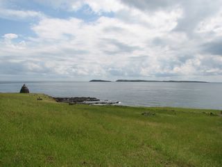 Figure 6: Stone tower (view of Dongji Islet from Xiji Islet) (Photo courtesy of the Headquarters).